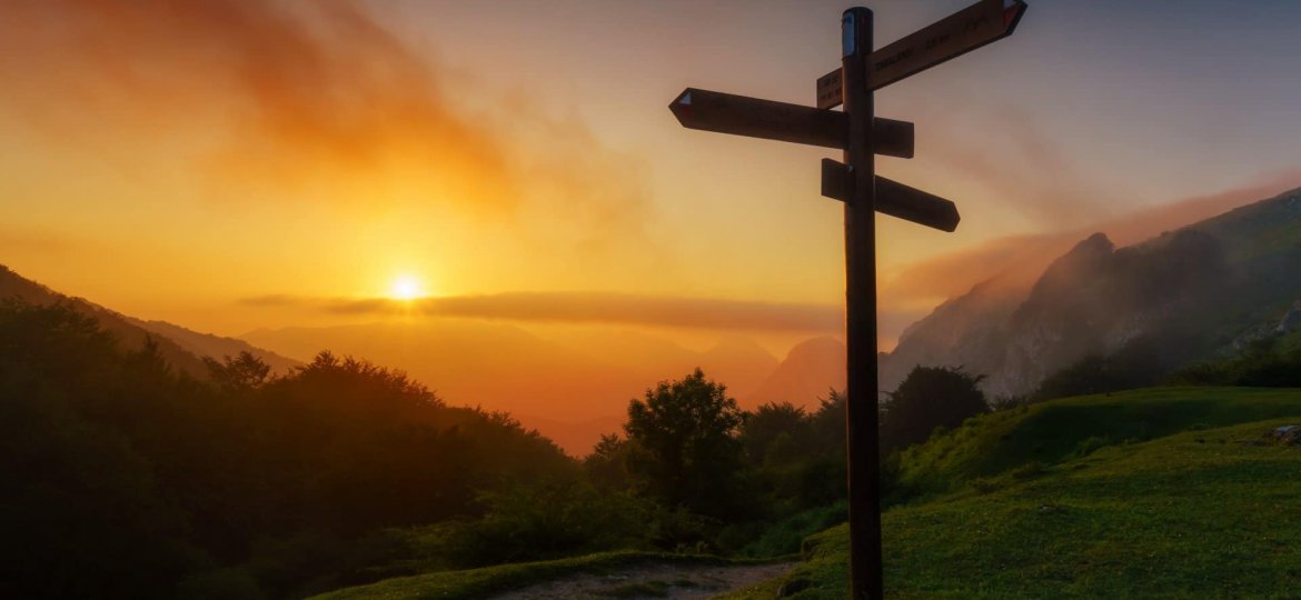 signpost in the mountain at sunset