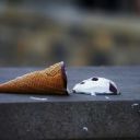 Dropped ice cream cone laying on the path